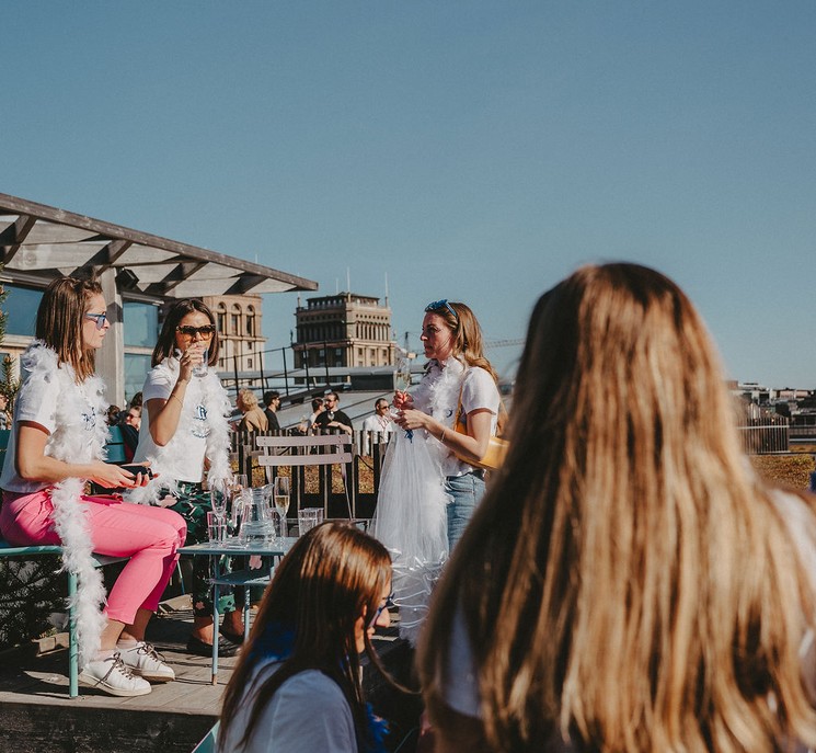 People at a rooftop bar.